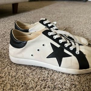 Slightly worn black and white golden goose dupes